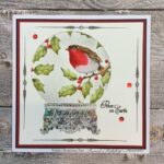 Sweet Poppy Gallery depicting an image of a Snow globe and robin stamp